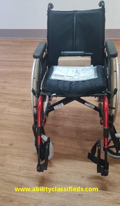 Basix 2 Breezy folding wheelchair with Permobil cushion